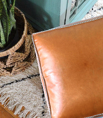 Stitched leather pouf